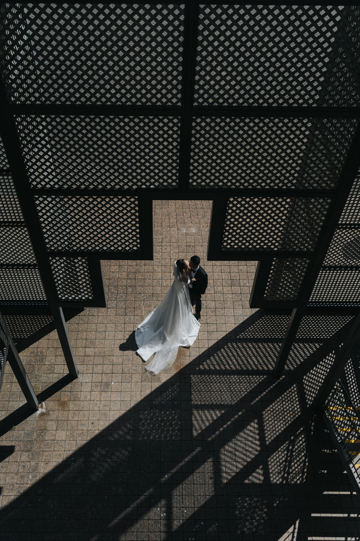 Overhead view of the couple among lattice shadows